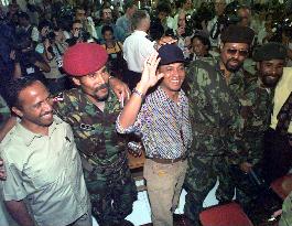 E. Timor pro-independence, pro-Indonesian militias link arms